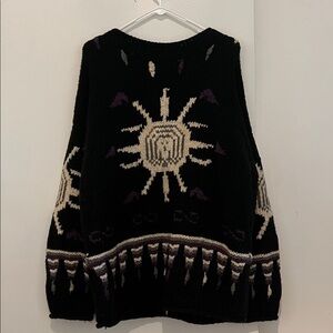 Chic Black and Cream Sunburst Sweater